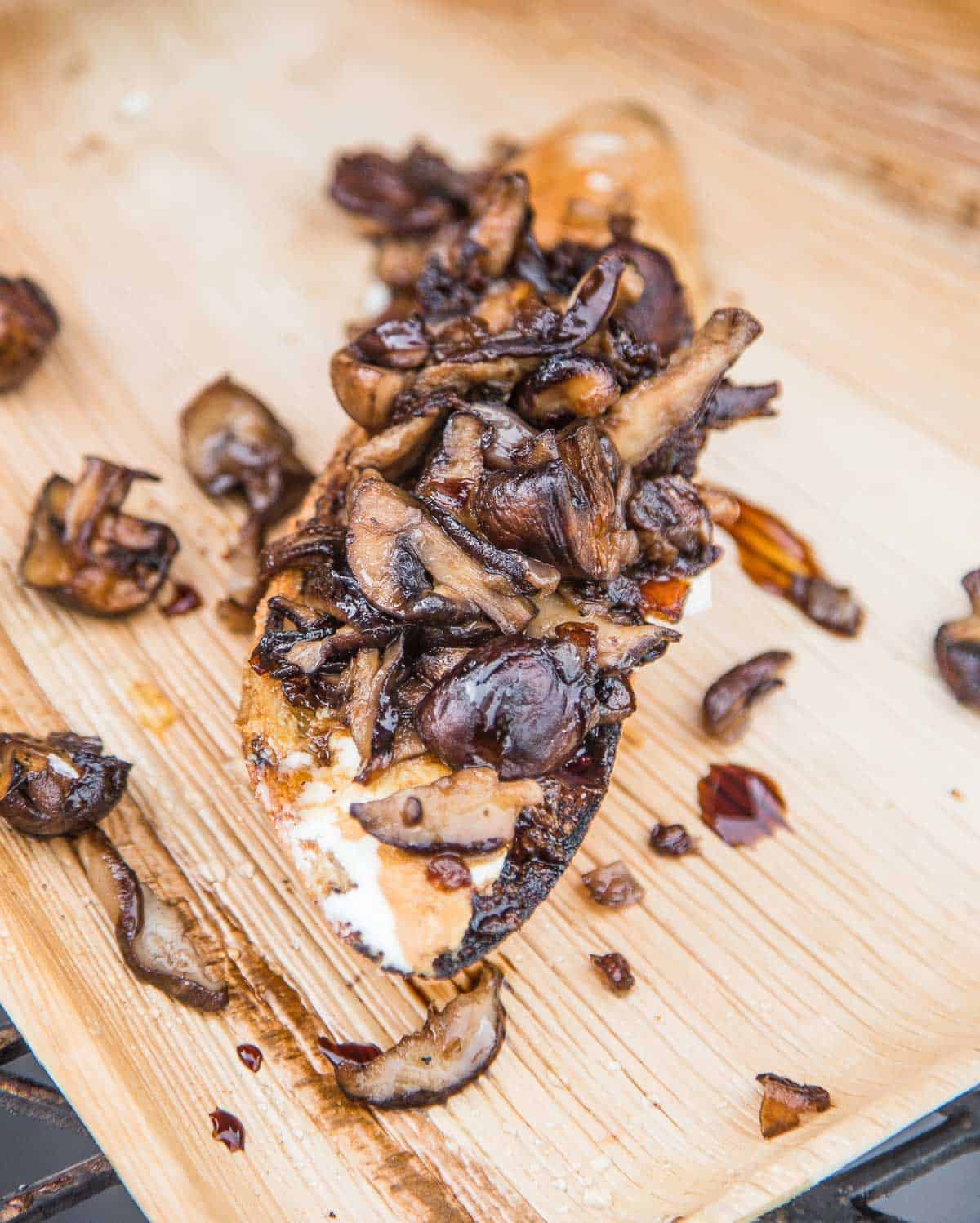 A toasted crostini topped with grilled mushrooms