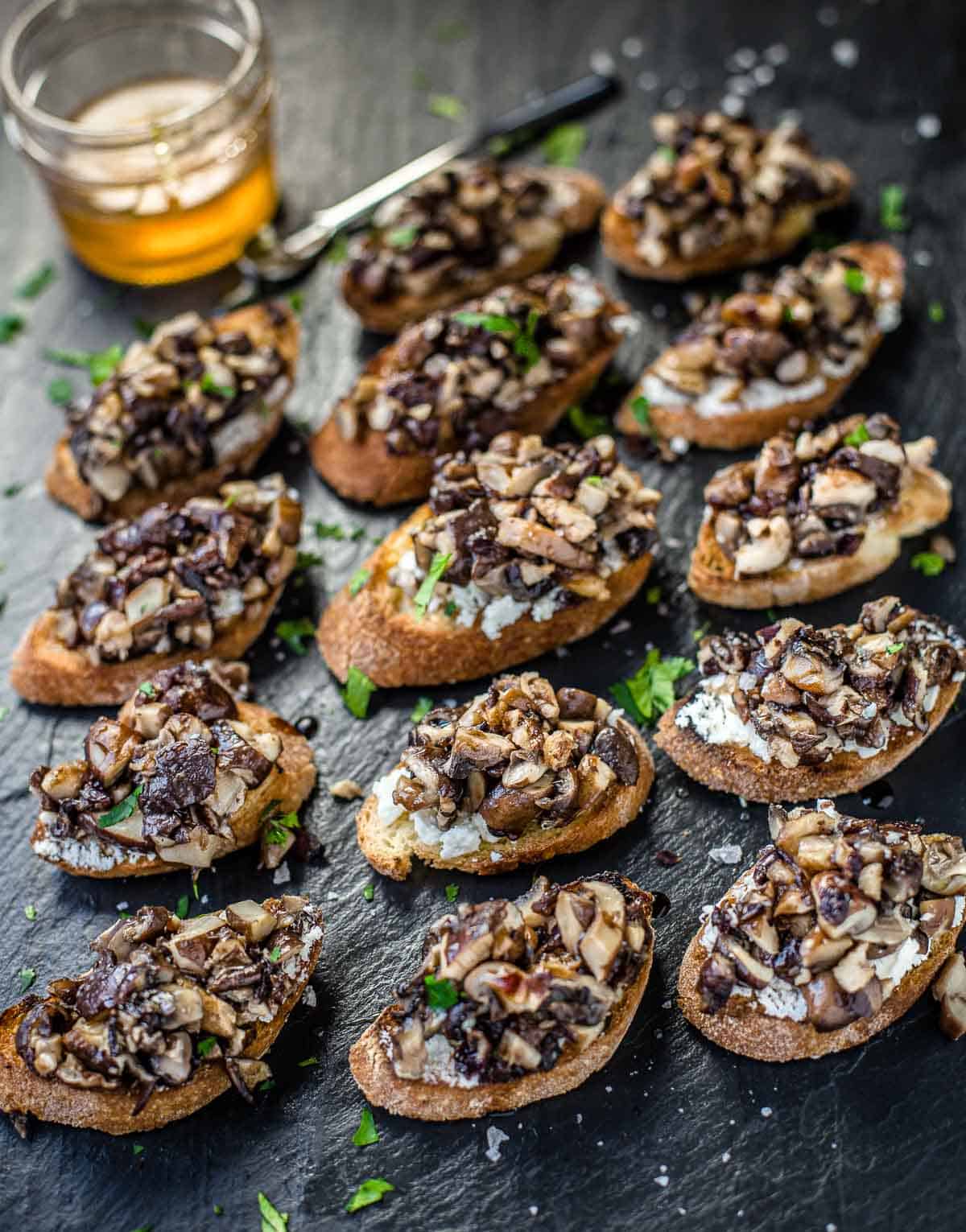 Grilled Mushroom Crostini on a platter with Smoked Honey and Aged Balsamic