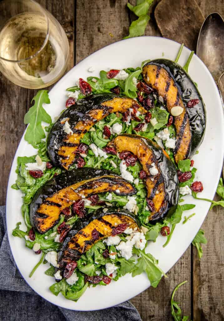 Grilled Acorn Squash over a bed of arugula.