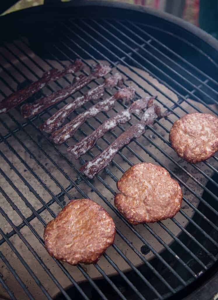 https://www.vindulge.com/wp-content/uploads/2019/10/How-to-smoke-sausage-and-bacon-on-the-grill-747x1024.jpg