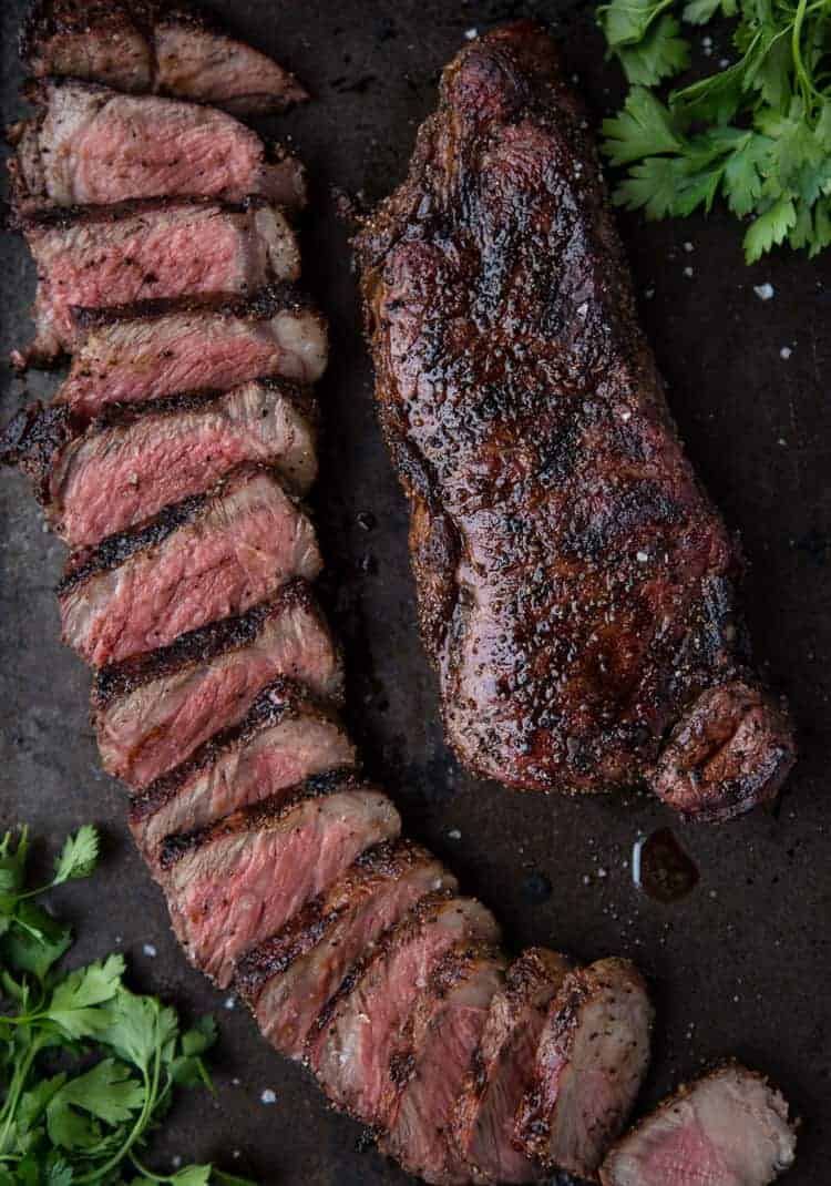 A perfect grilled steak, cooked to perfection and sliced 