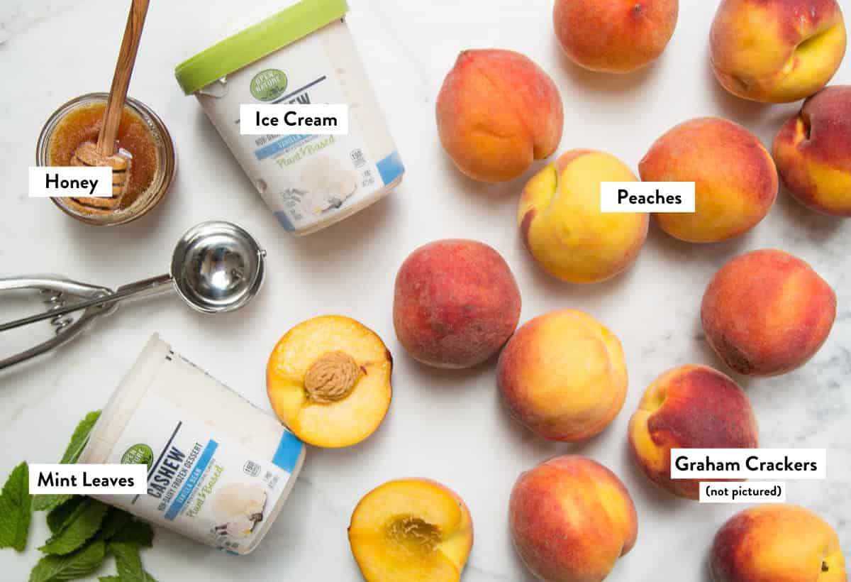 Ingredients for Grilled Peaches on a marble slab labeled with their names. 