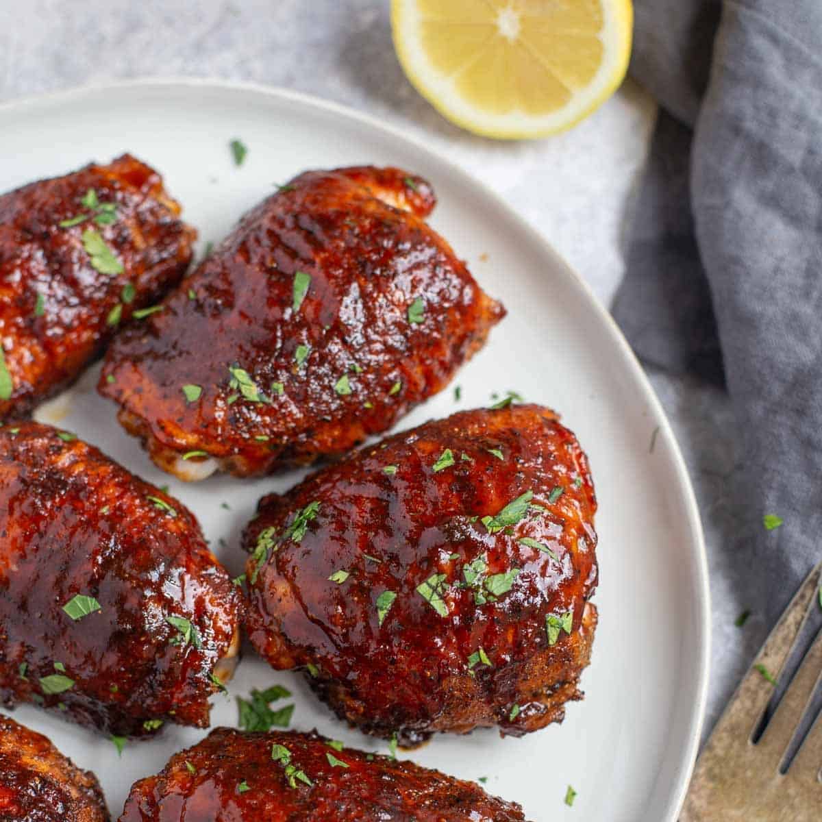 https://www.vindulge.com/wp-content/uploads/2022/04/Pellet-Grilled-Chicken-Thighs-with-bbq-sauce-square.jpg