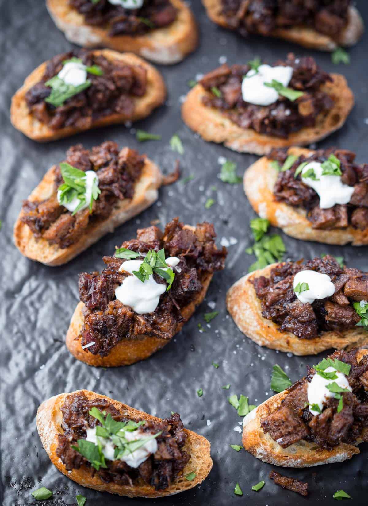 Brisket Bruschetta Crostini on a platter.