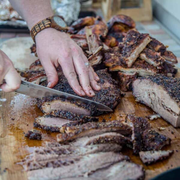 Slicing brisket into individual slices.