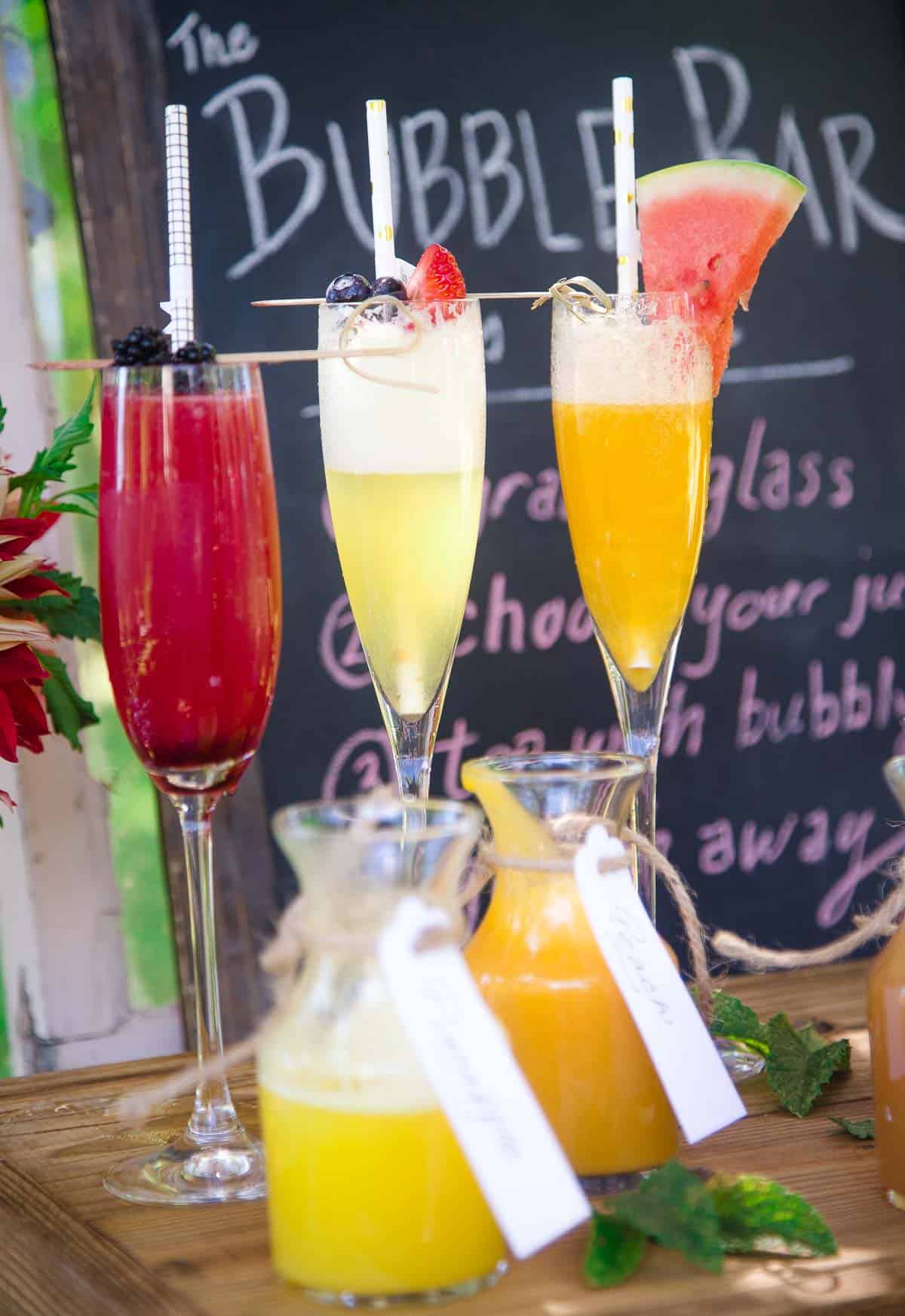 https://www.vindulge.com/wp-content/uploads/2023/04/Different-Kinds-of-Mimosas-at-a-Mimosa-Bar.jpg