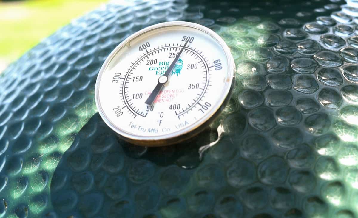 A dial thermometer on a Big Green Egg.