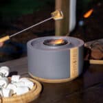 Terraflame S'mores kit with flame going and marshmallow being cooked.