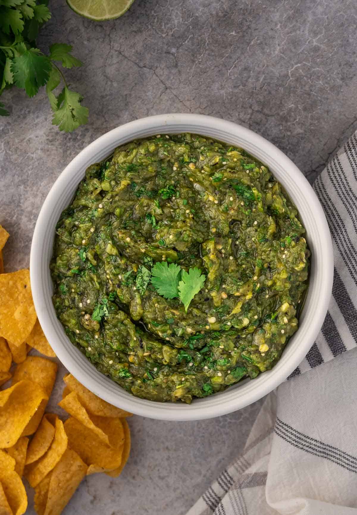 Hatch Green chile salsa in a bowl with tortilla chips.