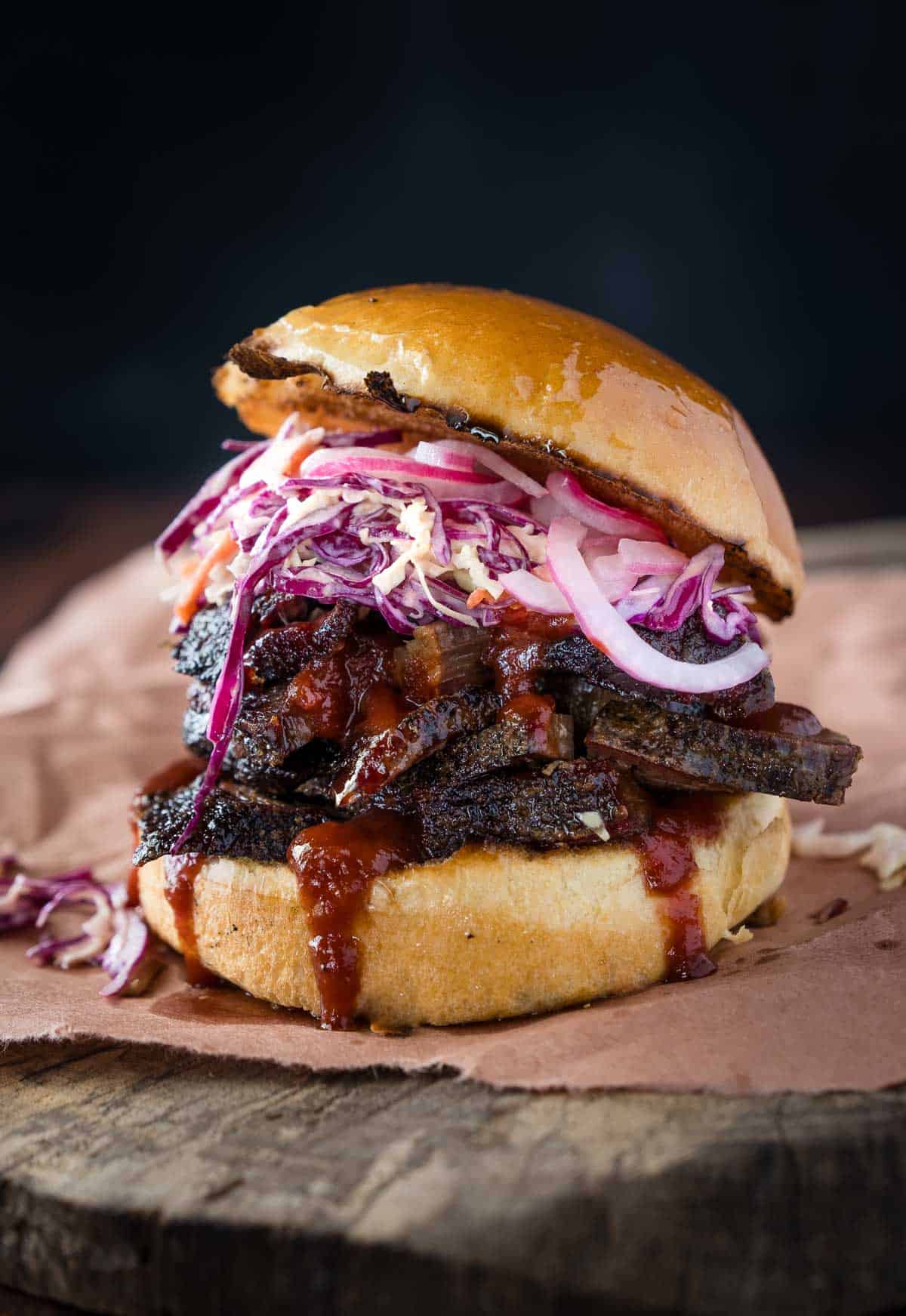 Delicious BBQ Brisket Sandwich topped with homemade coleslaw on a platter