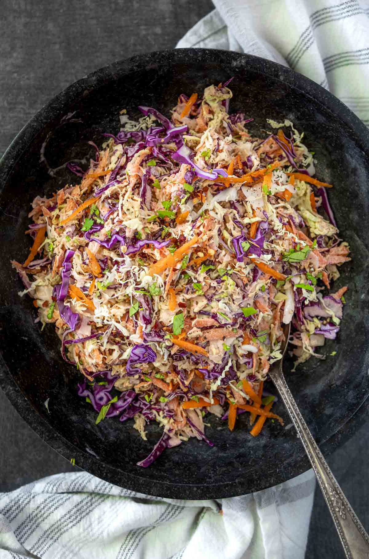 Easy Coleslaw (light mayo) in a large black bowl