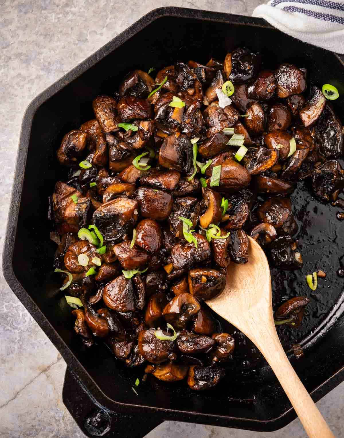 Steakhouse mushrooms in a cast iron pan
