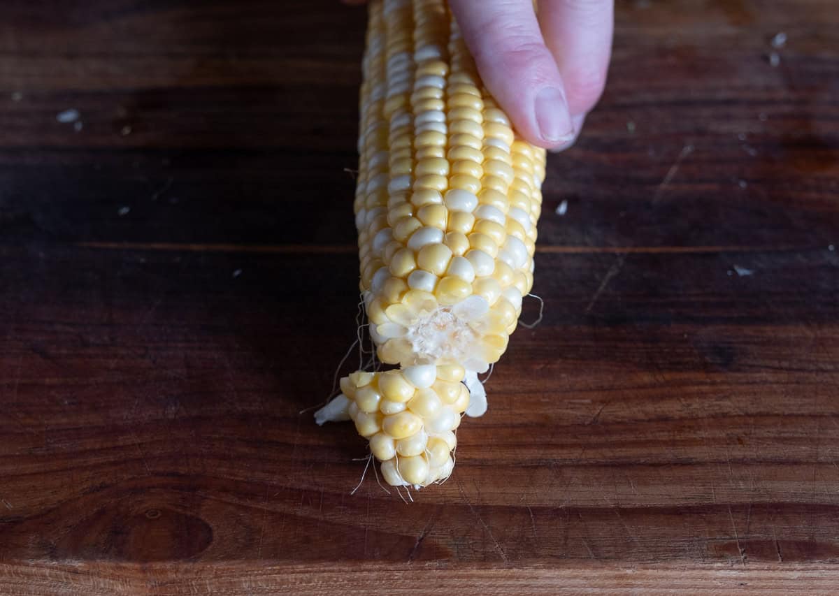 The tip removed from a corn cob in preparation for corn riblets.