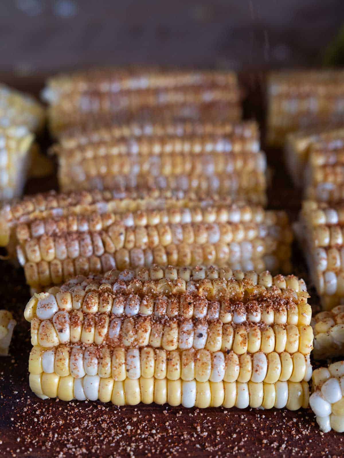 Seasoned corn ribs on a cutting board.