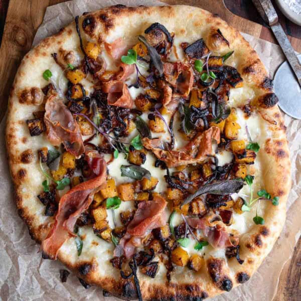 Butternut Squash, Caramelized Onion, and Prosciutto Pizza after being cooked in a pizza oven