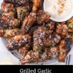 Pinterest Pin showing garlic Parmesan wings on a plate with ranch.