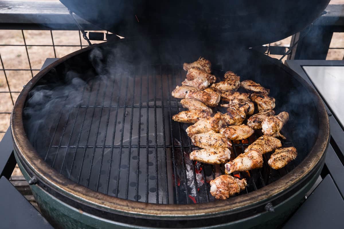 Garlic Parmesan Wings on a Big green egg set up for two zone grilling and over direct side.