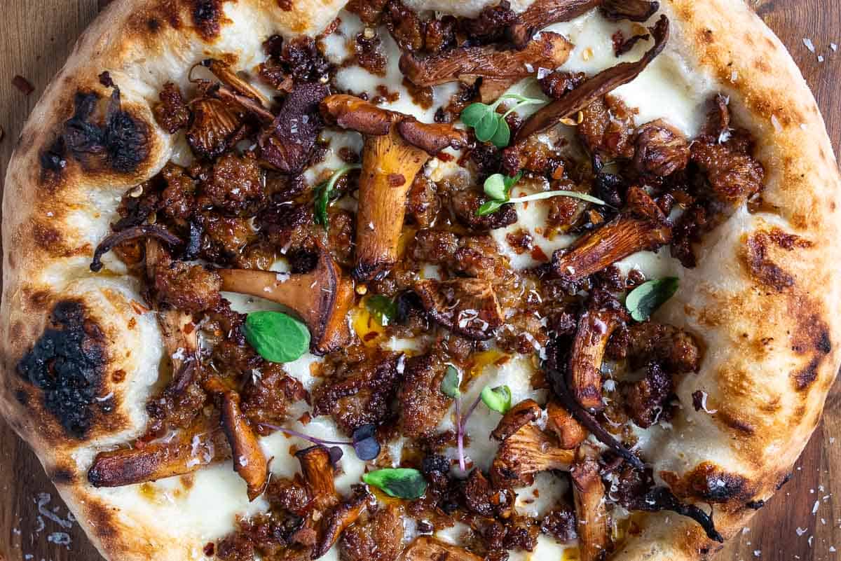 Chanterelle and mushroom pizza with garlic oil base.