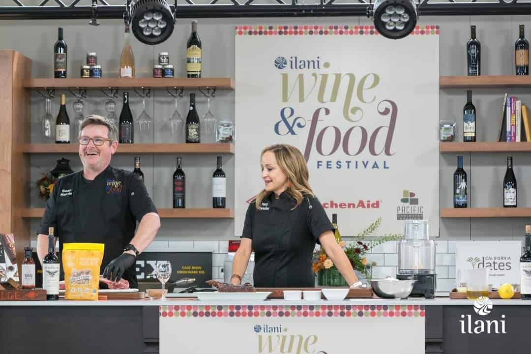 Sean Martin and Mary Cressler performing a food demonstration on stage at Ilani Casinos Wine and Food festival.