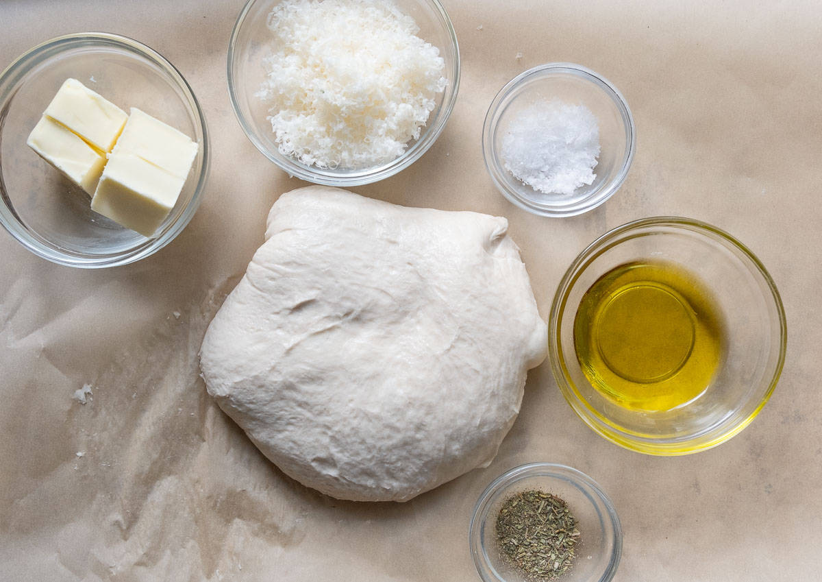 ingredients for garlic knots on a baking sheet