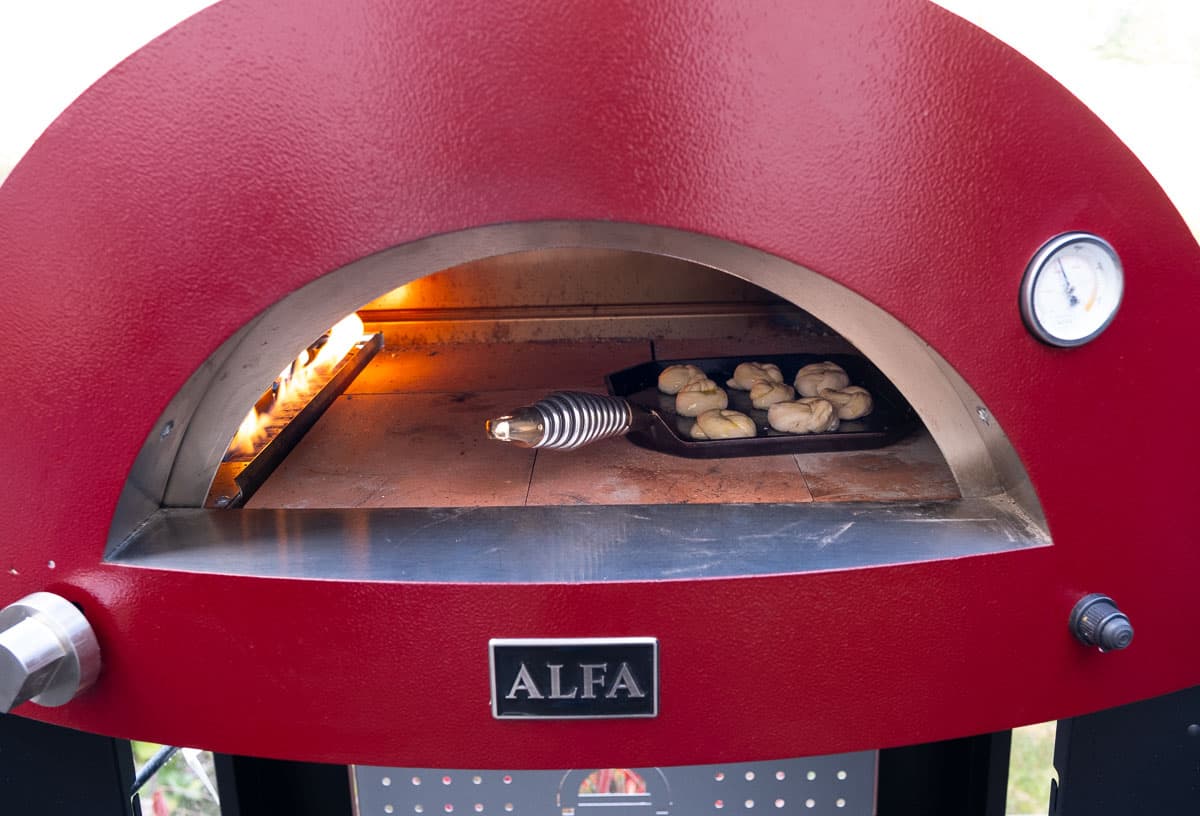 Garlic knots being cooked in an Alfa Forni pizza oven