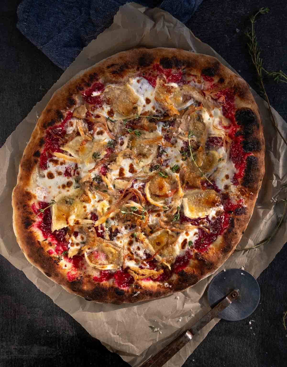 Leftover turkey pizza on a pizza peel.