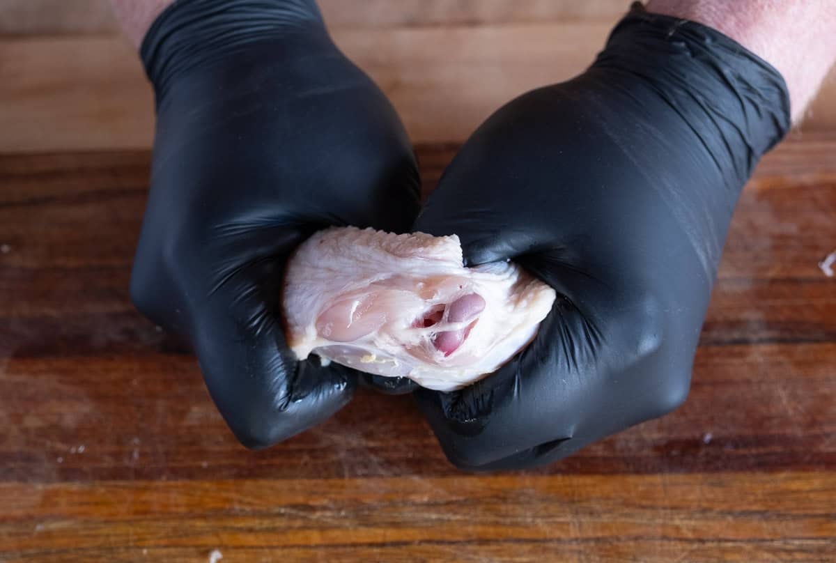 Separating drums and flats of a whole chicken wing step 3.