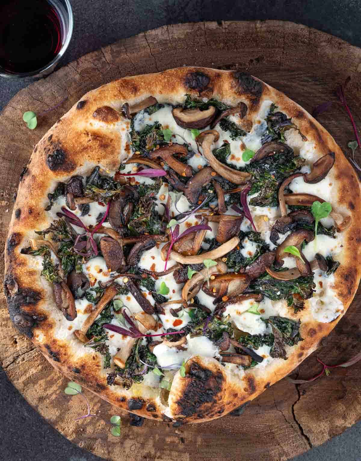 Kale and Wild Mushroom Pizza on a serving platter.