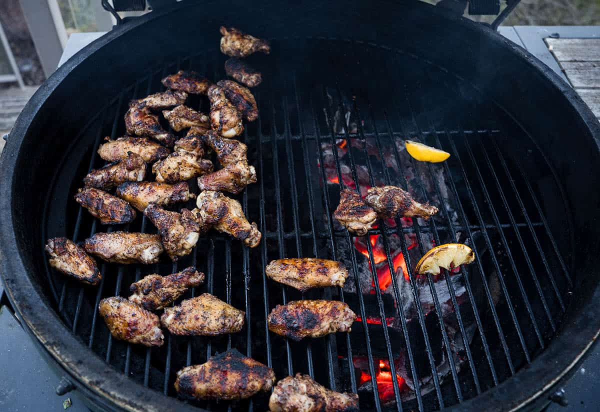 Grilled chicken wings on a Big Green Egg grill, cooking over indirect heat.