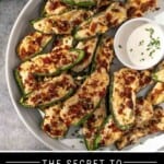 A pinterest pin showing a plate of 20 grilled jalapeño poppers with a side of ranch covered in fresh chives and bacon.