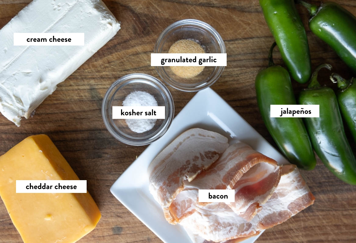 Ingredients for jalapeño poppers on a cutting board with text overlay describing each ingredient.