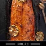 Pinterest pin showing a salmon on a cedar plank over direct heat glazed with hot honey.