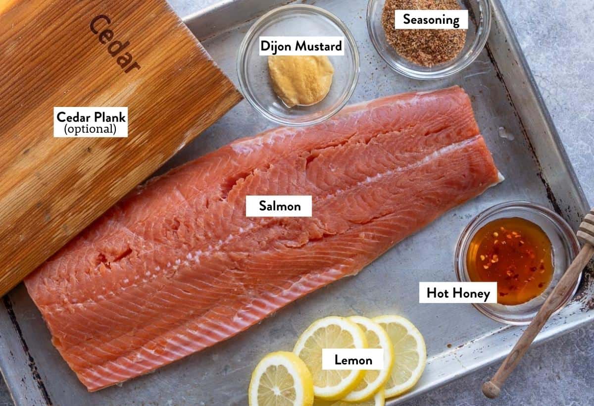 Ingredients for Hot Honey Salmon on a sheet tray labeled with their ingredient names.