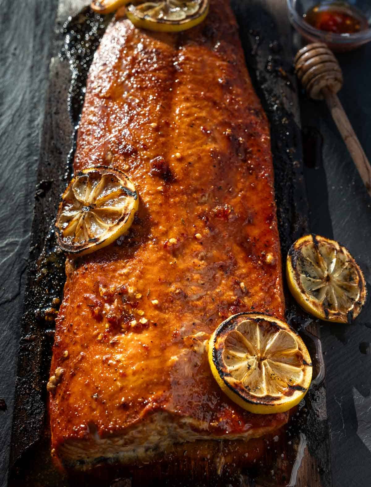 Grilled Hot Honey Salmon resting on a serving platter.